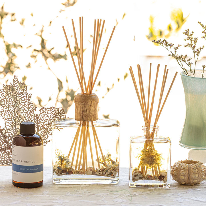 Large and Small Rosy Rings Coastal Vanilla Scented Reed Diffuser displayed next to Diffuser Refill Bottle