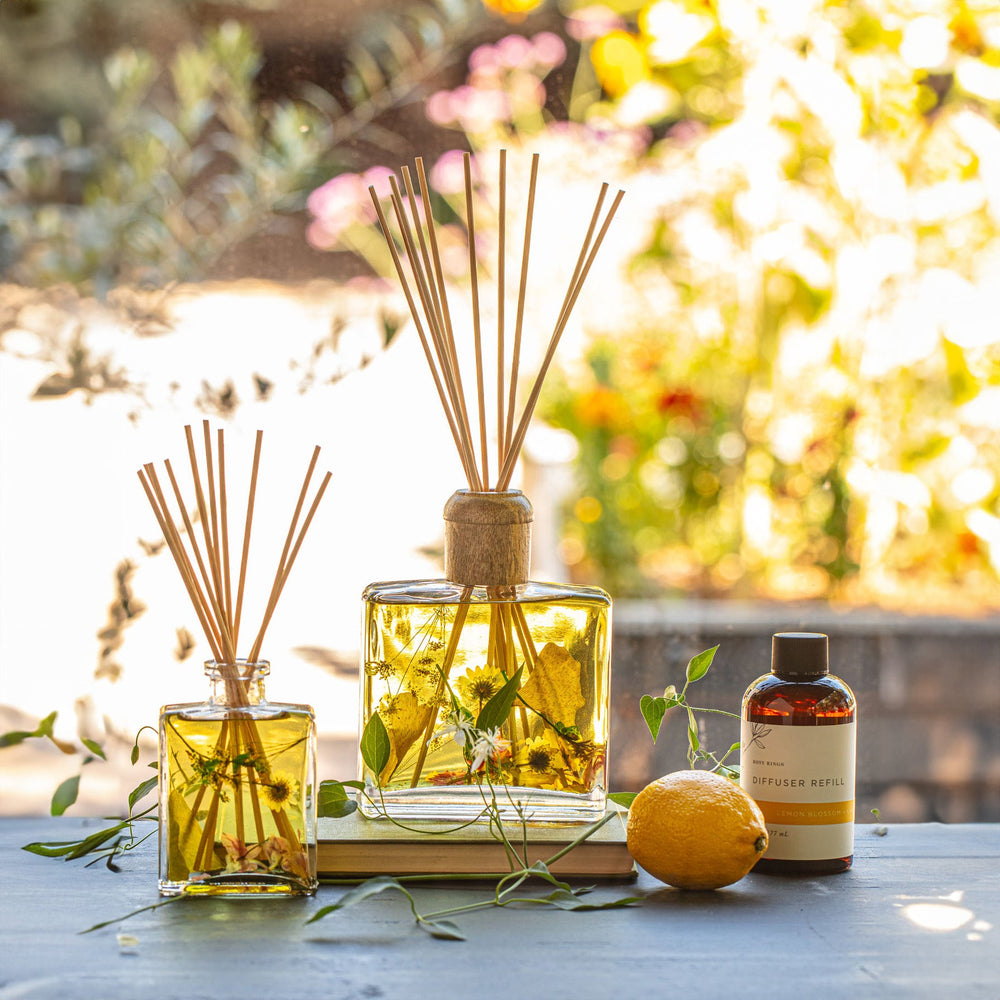 Large and Small Rosy Rings Lemon Blossom & Lychee Scented Reed Diffuser displayed next to Diffuser Refill Bottle