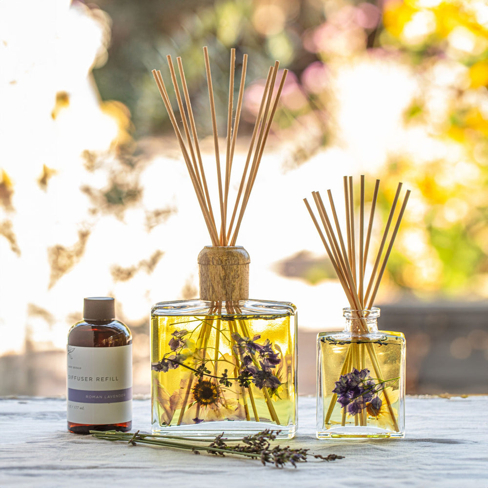 Large and Small Rosy Rings Roman Lavender & Lychee Scented Reed Diffuser displayed next to Diffuser Refill Bottle