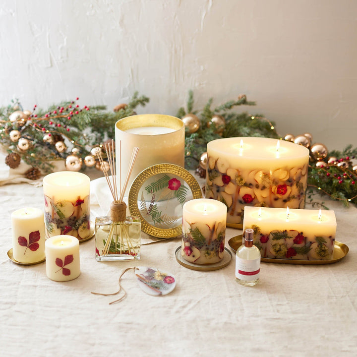 Rosy Rings Spicy Apple Scented Reed Diffuser displayed next to Spicy Apple Collection Candles in various sizes